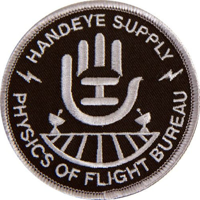 Round Handeye Physics of Flight Bureau embroidered patch with white lettering and a gray hand symbol on black fabric.