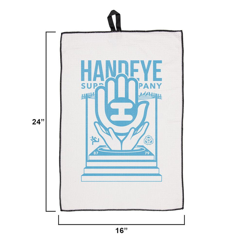 White Handeye waffle weave podium towel with a blue hand and "HANDEYE" logo and black trim.