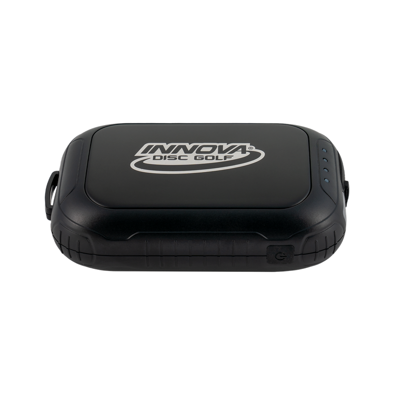 Black Innova Disc Golf hand warmer and battery pack with the brand logo and indicator lights visible.