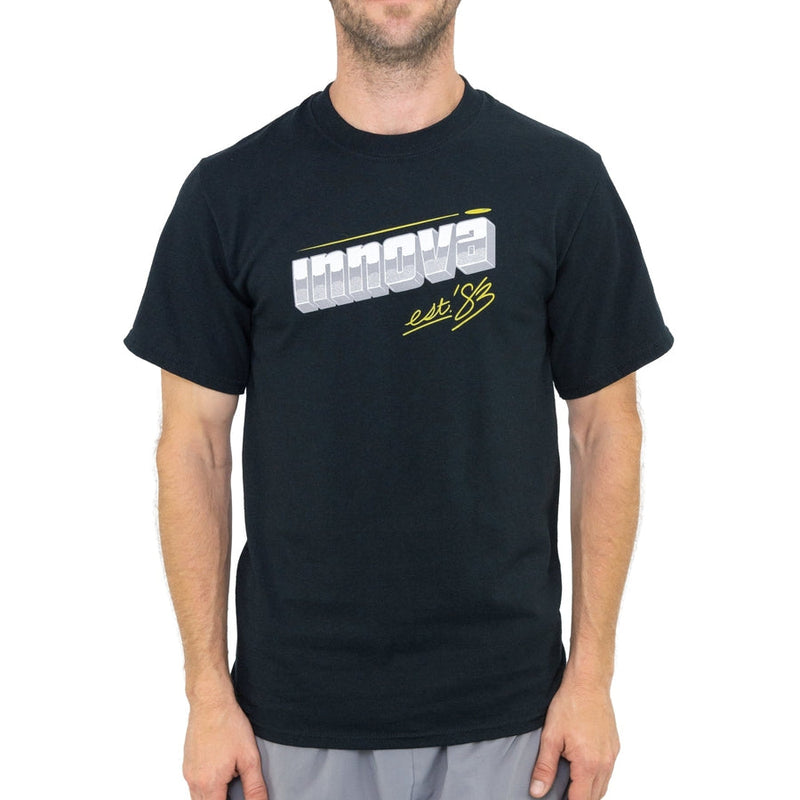 Black short-sleeve t-shirt with a gray, 3D Innova logo and yellow "est &