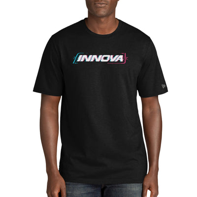 Man wearing a black Innova Cypher New Era Tri Blend T-shirt with a pixelated blue and pink logo.