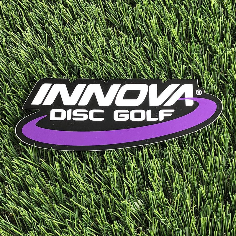 Black Innova Disc Golf die-cut sticker with a purple swoop beneath the white Innova lettering.