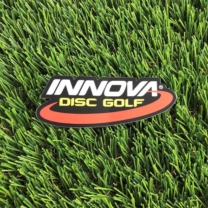 Die-cut Innova Disc Golf sticker featuring white Innova text, yellow DISC GOLF text, and a red curved accent.