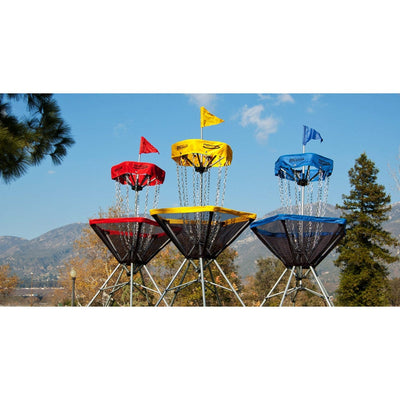 Three Innova Discatcher Traveler targets with yellow, red, and blue tops, each featuring silver chains and flags.
