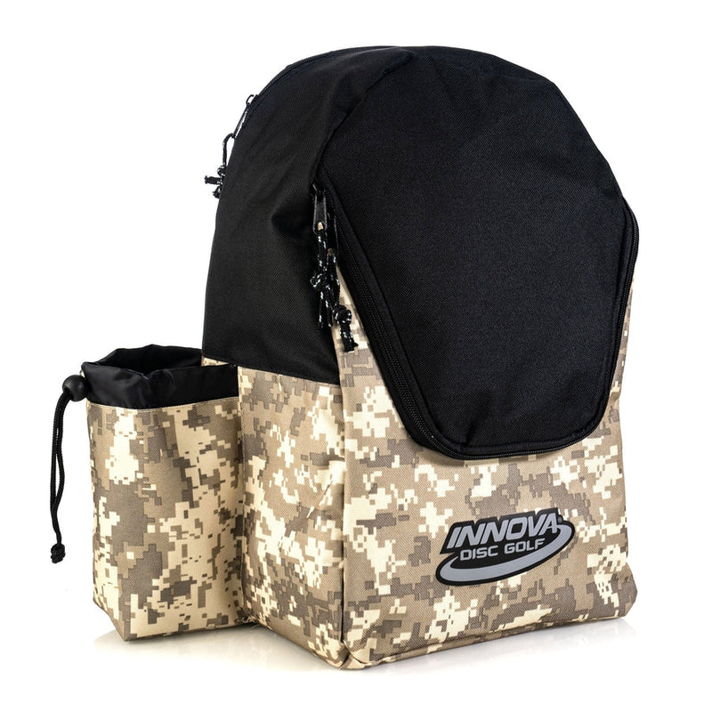 Black and tan digital camouflage Innova Disc Discover Bag with a black zippered top and a cinched side pocket.
