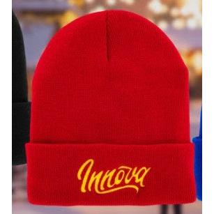 Bright red cable knit Innova Flow Cuff Beanie with a yellow embroidered Innova script logo on the folded cuff.
