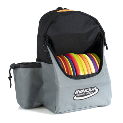 Gray Innova Discover bag with a black top flap and multiple colorful disc golf discs clearly visible inside.