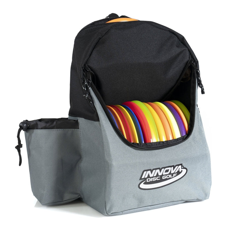 Gray Innova Discover bag with a black top flap and multiple colorful disc golf discs clearly visible inside.