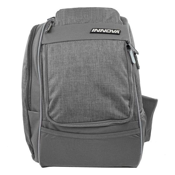 Gray Innova Excursion Pack disc golf bag with zippered compartments and a textured fabric front.