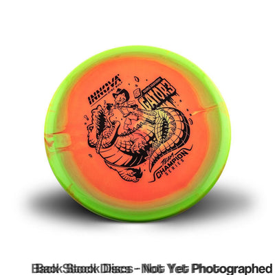 Orange Innova Halo Champion Gator3 disc with a black alligator stamp and a bright green rim.