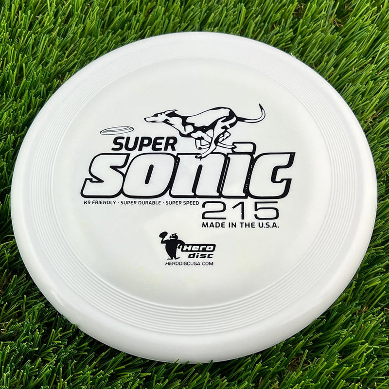 White Innova Hero Super Sonic 215 K9 disc with a black dog graphic and "Made in the U.S.A." text.