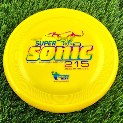 Round yellow Innova Hero Super Sonic 215 frisbee with a colorful leaping dog graphic above the text.