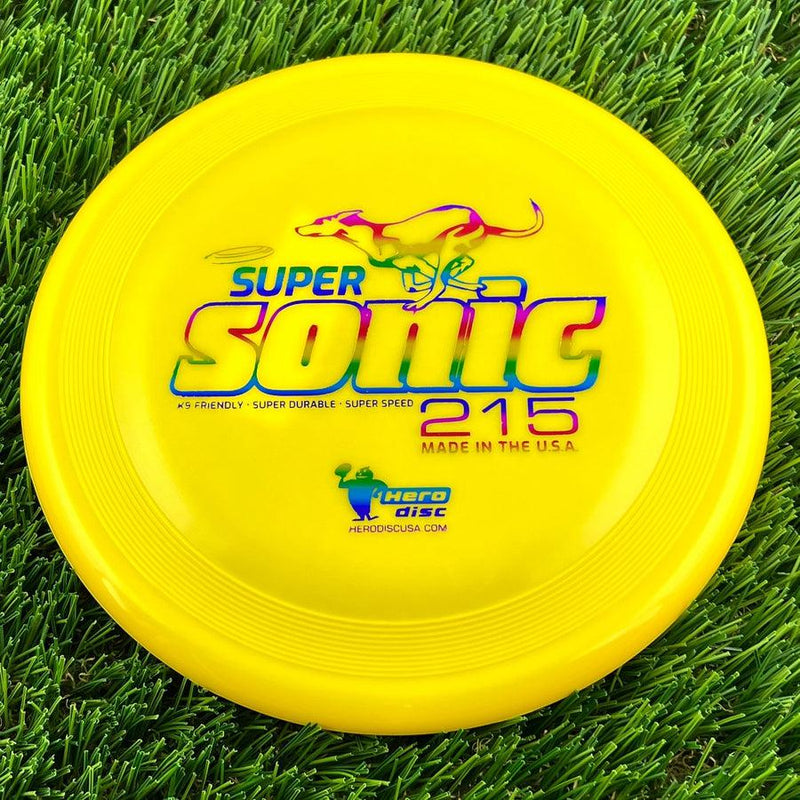 Round yellow Innova Hero Super Sonic 215 frisbee with a colorful leaping dog graphic above the text.