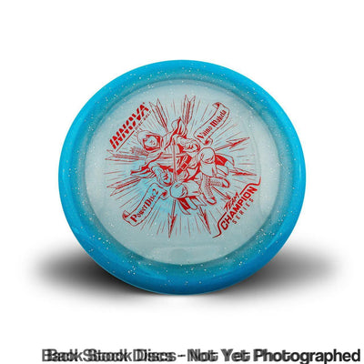 Light blue Innova Moondust Halo Champion Power Disc 2 with red Vaino Makela Team Champion Tour Series stamp.