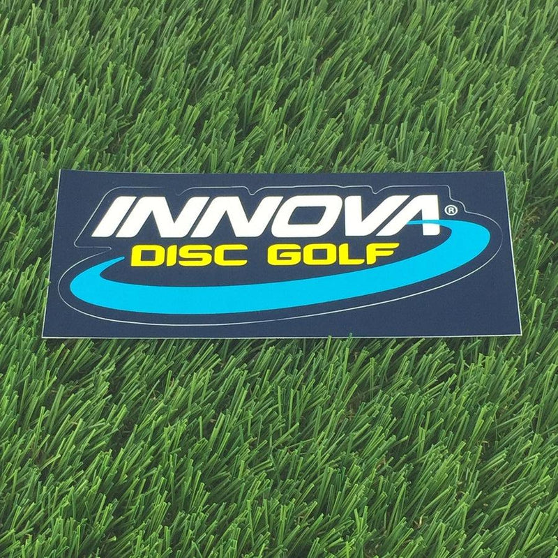 Navy blue Innova Disc Golf sticker with white Innova lettering and yellow "Disc Golf" text over a light blue swoosh.