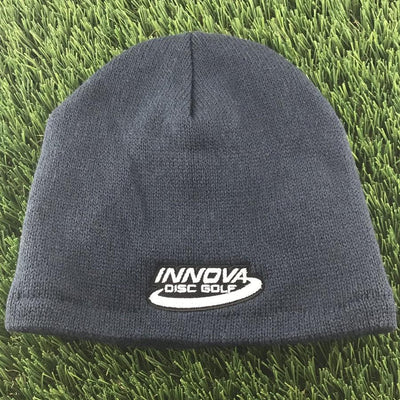 Navy blue Innova embroidered logo solid fleece beanie with white lettering and border.