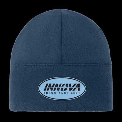 Navy blue fleece beanie with a light blue and black oval Innova "Throw Your Best" embroidered patch.