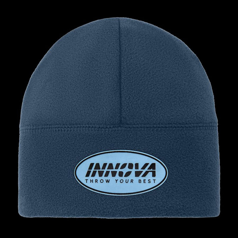 Navy blue fleece beanie with a light blue and black oval Innova "Throw Your Best" embroidered patch.
