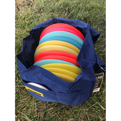 Navy blue Innova Weekender disc golf bag filled with colorful plastic discs and a yellow tag.