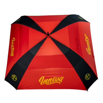 Red and black Innova Flow umbrella with yellow Innova branding visible on multiple panels.