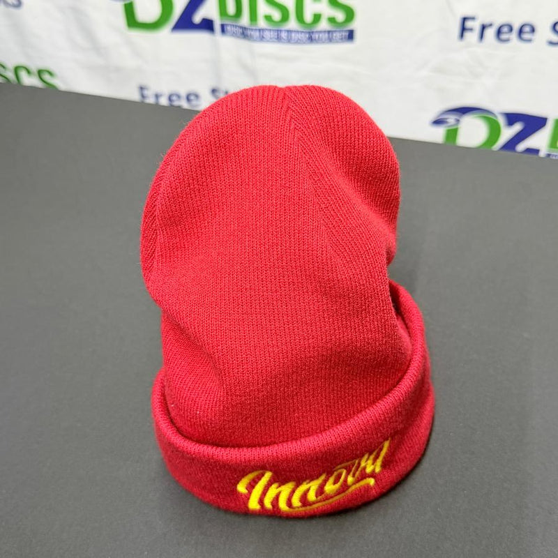 Red knitted Innova Flow Cuff Beanie with "Innova" embroidered in yellow script on the folded hem.