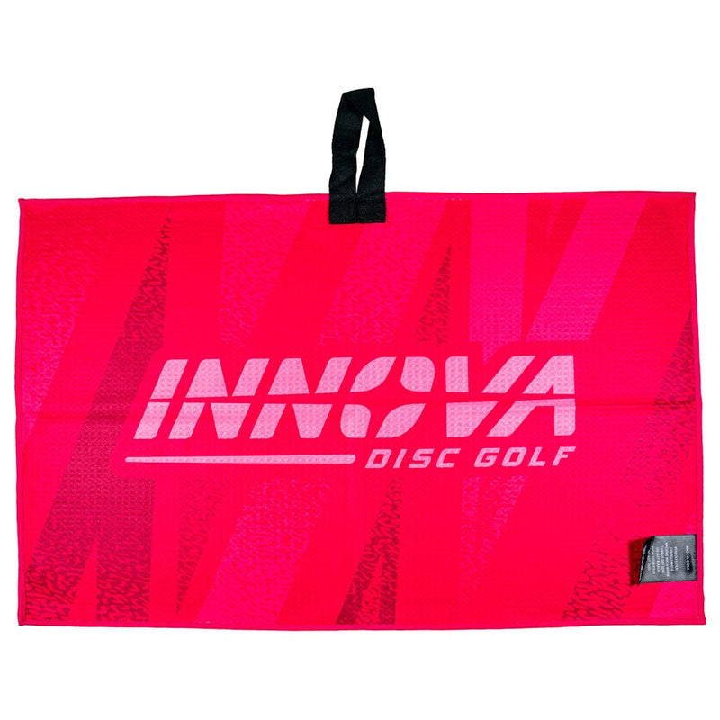 Bright red Innova tour towel with "INNOVA DISC GOLF" logo and a black hanging loop on top.