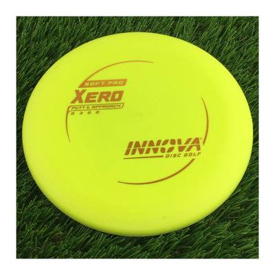 Solid yellow Innova Soft Pro Xero Putter & Approach disc golf disc with a red burst logo stock stamp.