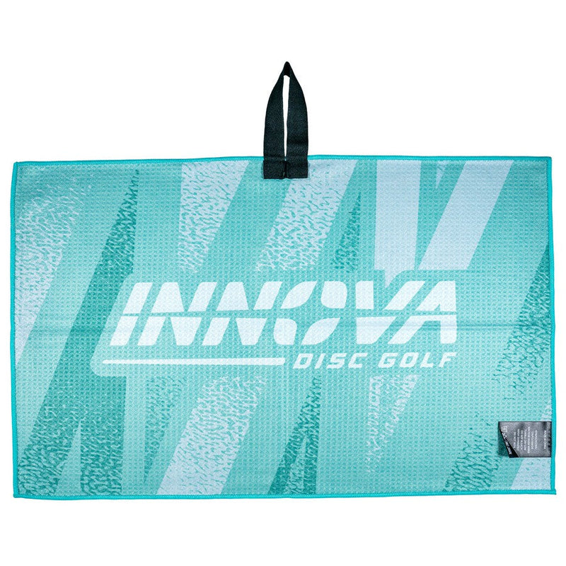 Teal Innova Tour Towel with a white Innova Disc Golf logo and a black hanging loop.