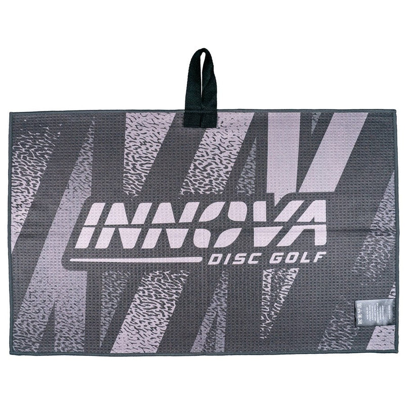 Dark gray Innova Tour Towel Wildhorse with light gray graphics, waffle texture, and a black hanging loop.