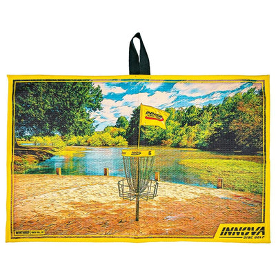 Yellow Innova Tour Towel with a vibrant Winthrop scenic disc golf course print and a black hanging loop.