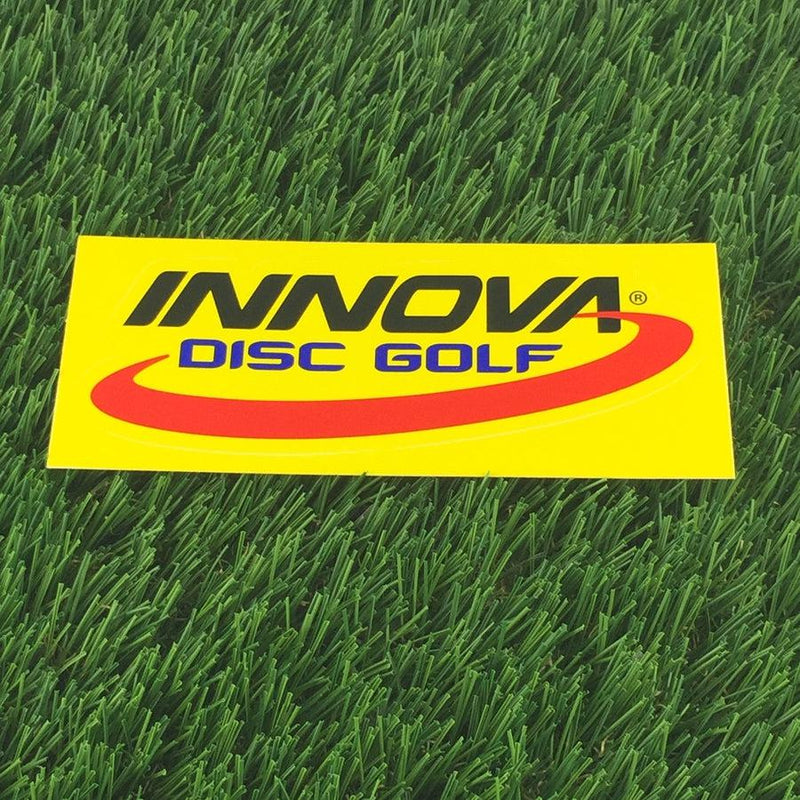 Yellow Innova Disc Golf die-cut sticker with black Innova text, blue curved "DISC GOLF" text, and a red swoosh.