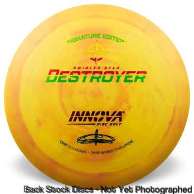 Yellow swirled Innova Star Destroyer disc golf disc featuring red and green branding and Ohn Scoggins' signature.