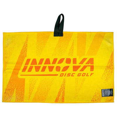 Bright yellow Innova Winthrop Tour Towel featuring a large orange Innova Disc Golf logo and a black hanging loop.