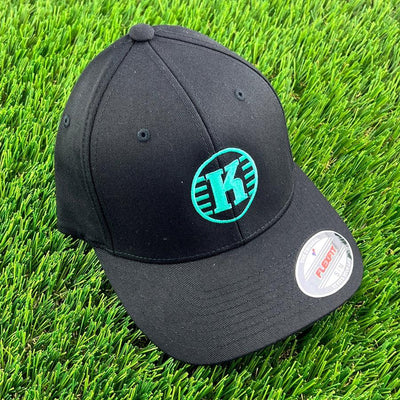 Black Flexfit Kastaplast hat featuring the bold green K-logo embroidered centrally on the front panel.