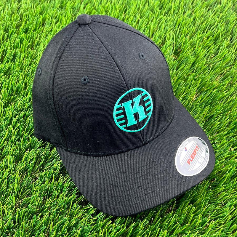 Black Flexfit Kastaplast hat featuring the bold green K-logo embroidered centrally on the front panel.