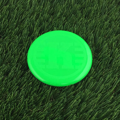 Bright green Kastaplast K Mini Marker disc golf mini marker with a subtle textured K logo on the flight plate.