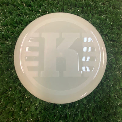 Light off-white Kastaplast K Mini Marker disc golf marker disc with a large debossed K logo in the center.