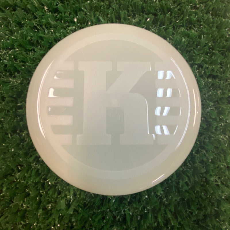 Light off-white Kastaplast K Mini Marker disc golf marker disc with a large debossed K logo in the center.