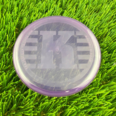 Translucent purple Kastaplast K Mini Marker disc golf marker with a large K logo and Swedish text.