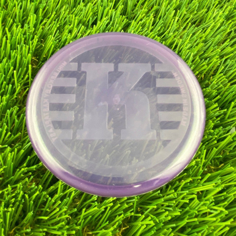 Translucent purple Kastaplast K Mini Marker disc golf marker with a large K logo and Swedish text.
