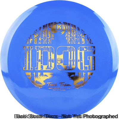 Blue Kastaplast K1 Hard I Dog disc golf putter with a gold "IDOG Tour Team" stamp featuring a forest design.