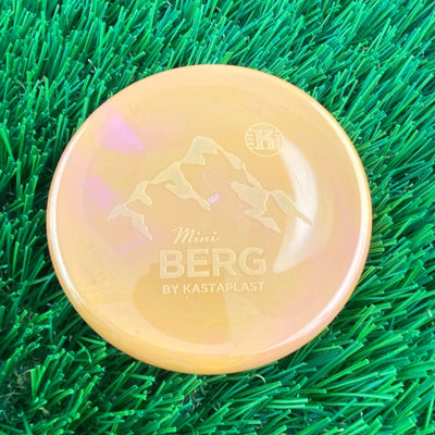Yellow Kastaplast Mini Berg disc golf marker with an embossed mountain graphic and brand logo.