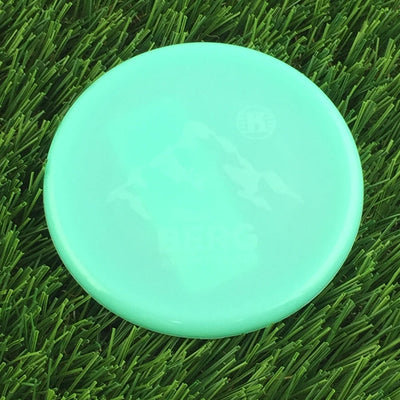 Teal Kastaplast Mini Berg marker disc featuring a light green mountain graphic and a subtle "BERG" text.