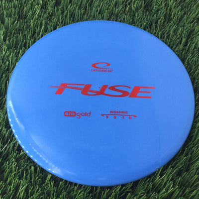 Solid blue Latitude 64 Gold Line Bio Fuse midrange disc golf disc with red 'FUSE' and 'bio gold' stamps.