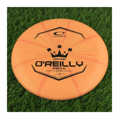 Solid orange Latitude 64 Royal Sense Burst Faith disc with a black Connor O'Reilly 2022 Team Series stamp.