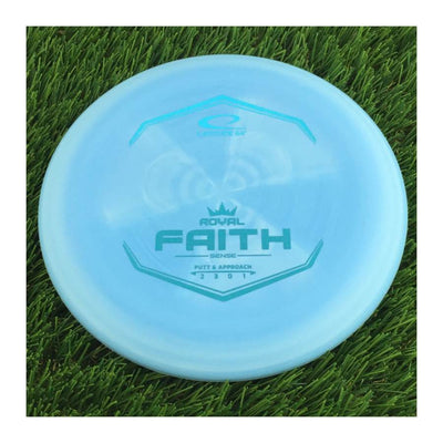 Round, light blue Latitude 64 Royal Sense Faith disc with a turquoise foil stamp and "Putt & Approach" text.