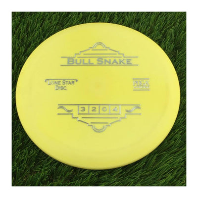 Solid yellow Lone Star Bull Snake disc golf disc with silver foil stamping of the disc's name and numbers 3 2 0 4.