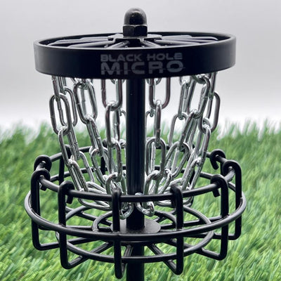 MVPMVP Black Hole Micro disc golf target features a dark frame, sturdy metal chains, and the brand name on top.