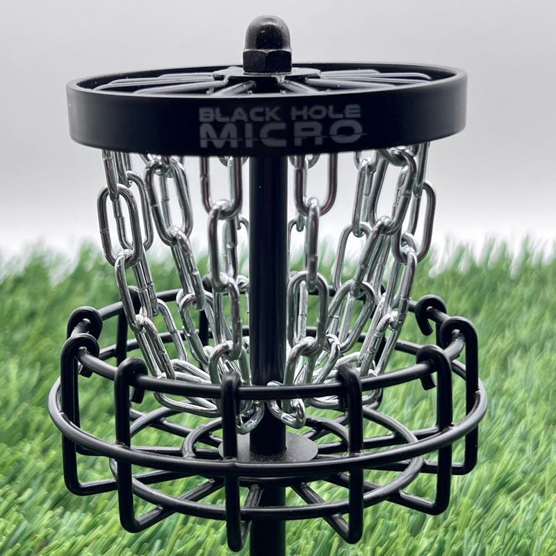 MVPMVP Black Hole Micro disc golf target features a dark frame, sturdy metal chains, and the brand name on top.
