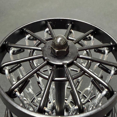 Top view of the MVP Black Hole Micro disc golf basket's black metal frame and silver chains.
